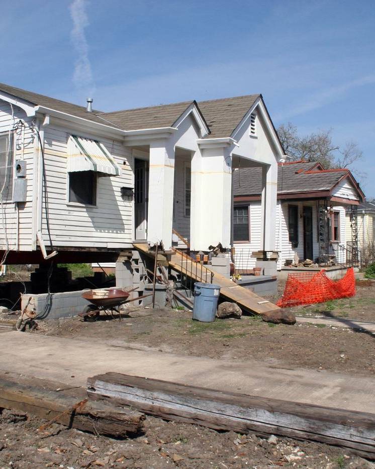 House raised on cribbing during repairs after a flood