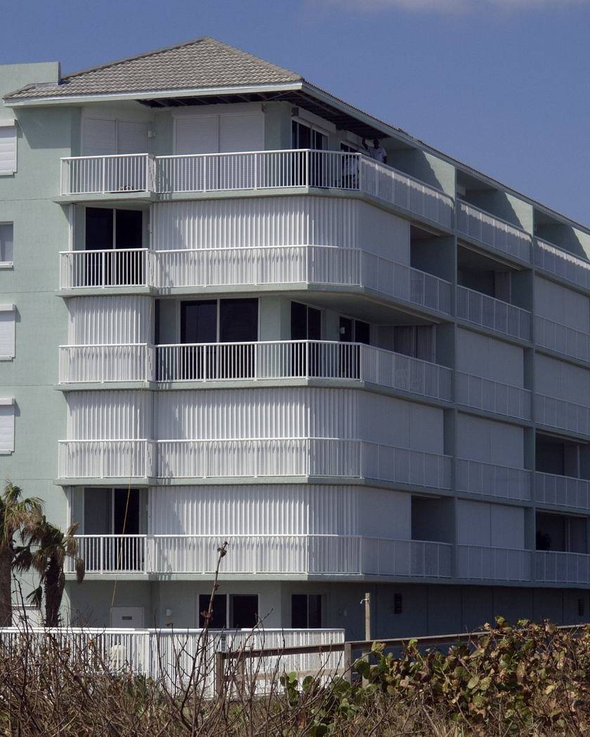 Building with hurricane shutters in Melbourne Beach, Florida
