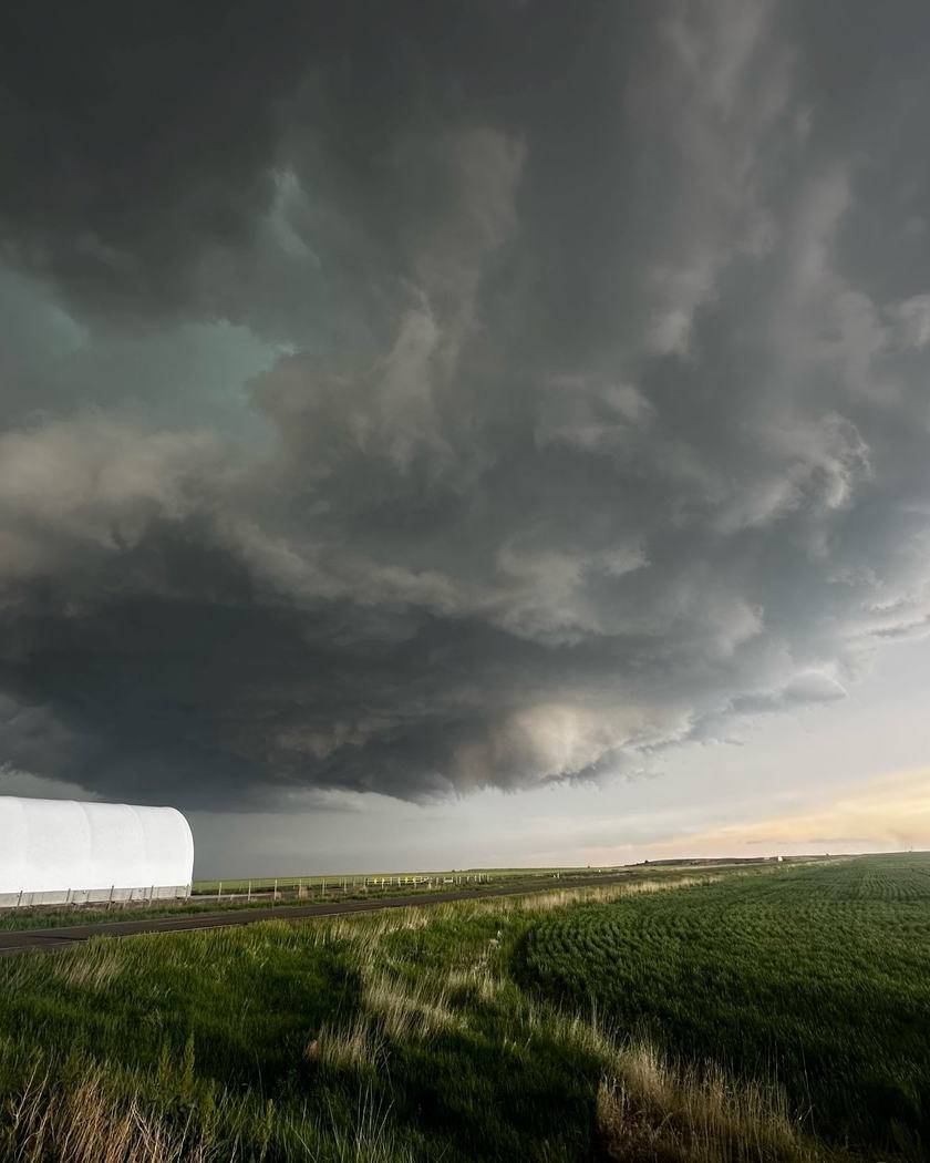 Supercell storm cloud over open farmland